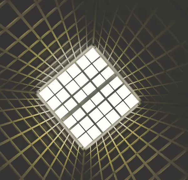 Abstract close-up of a white wall with subtle marks and variations, representing focused observation and perception