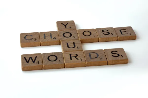 Scrabble tiles spelling out words on a surface